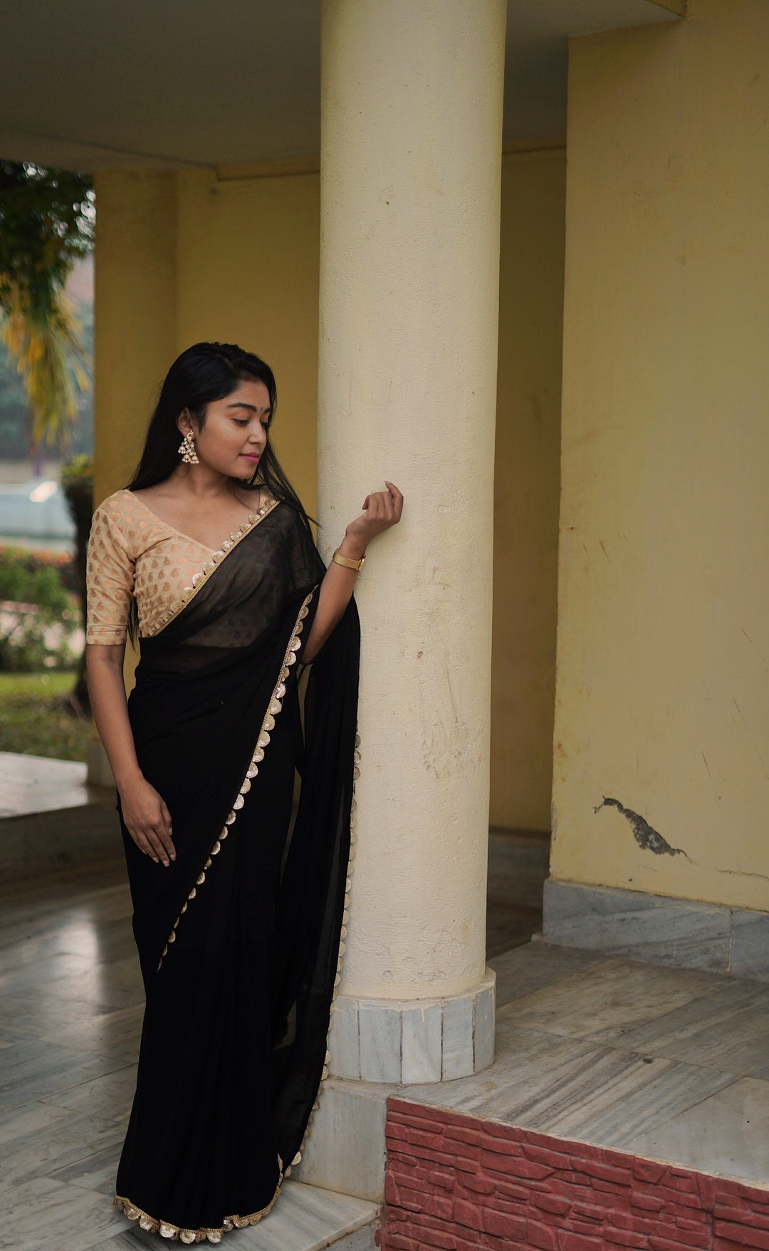 Gold sequinned black saree