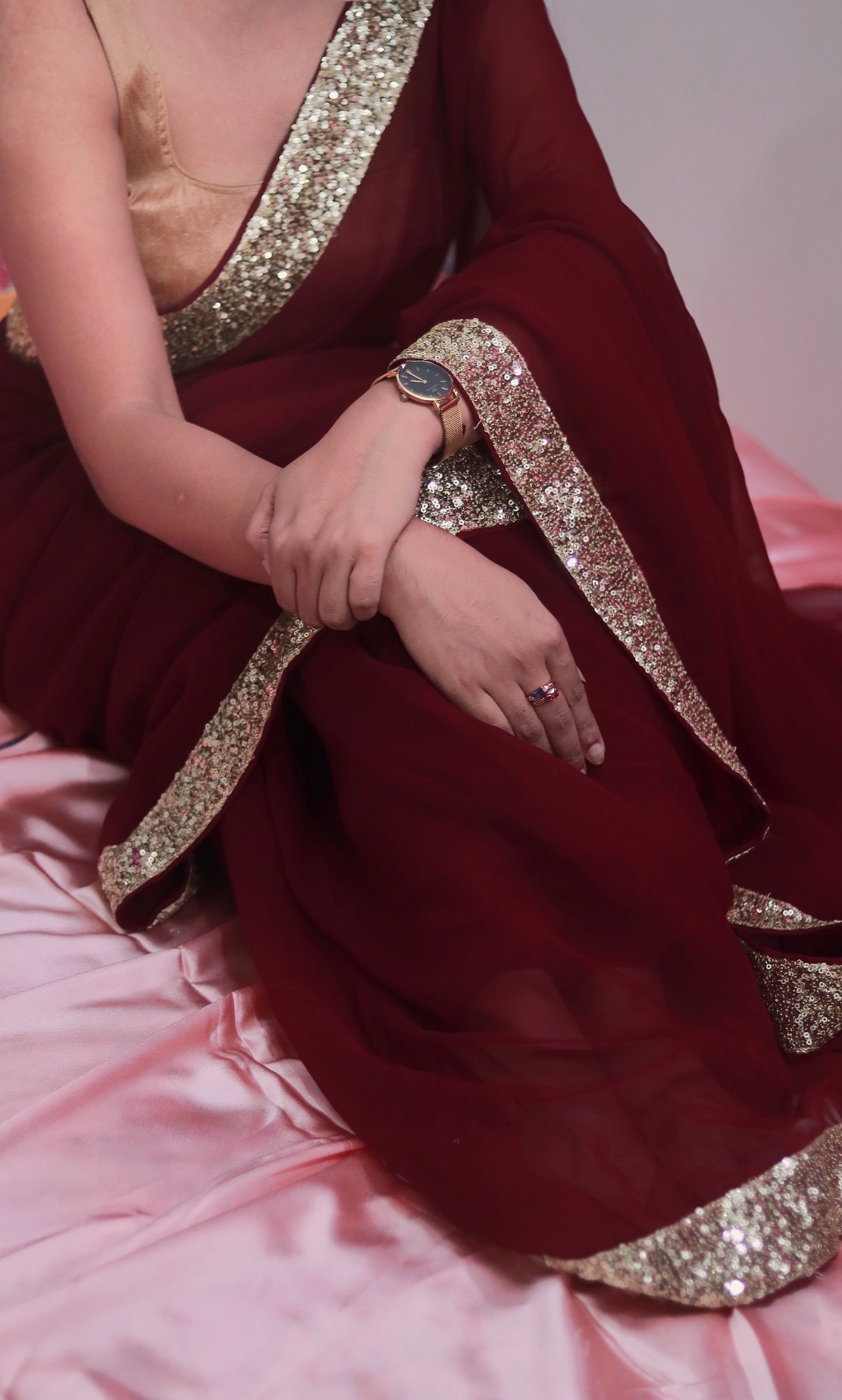 Sequins on maroon saree