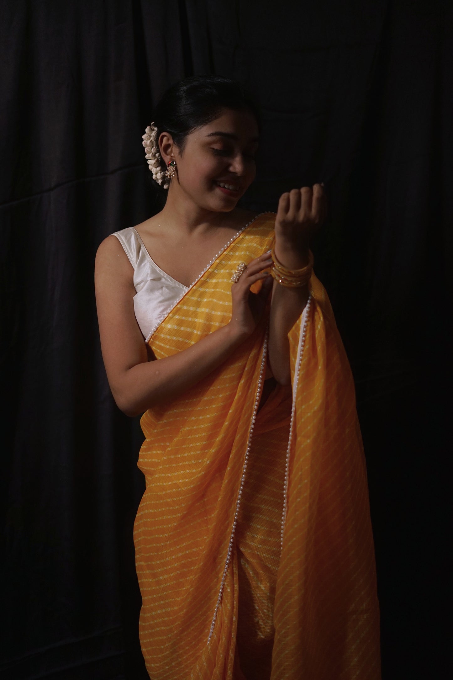 Pearls in Yellow Leheriya Saree