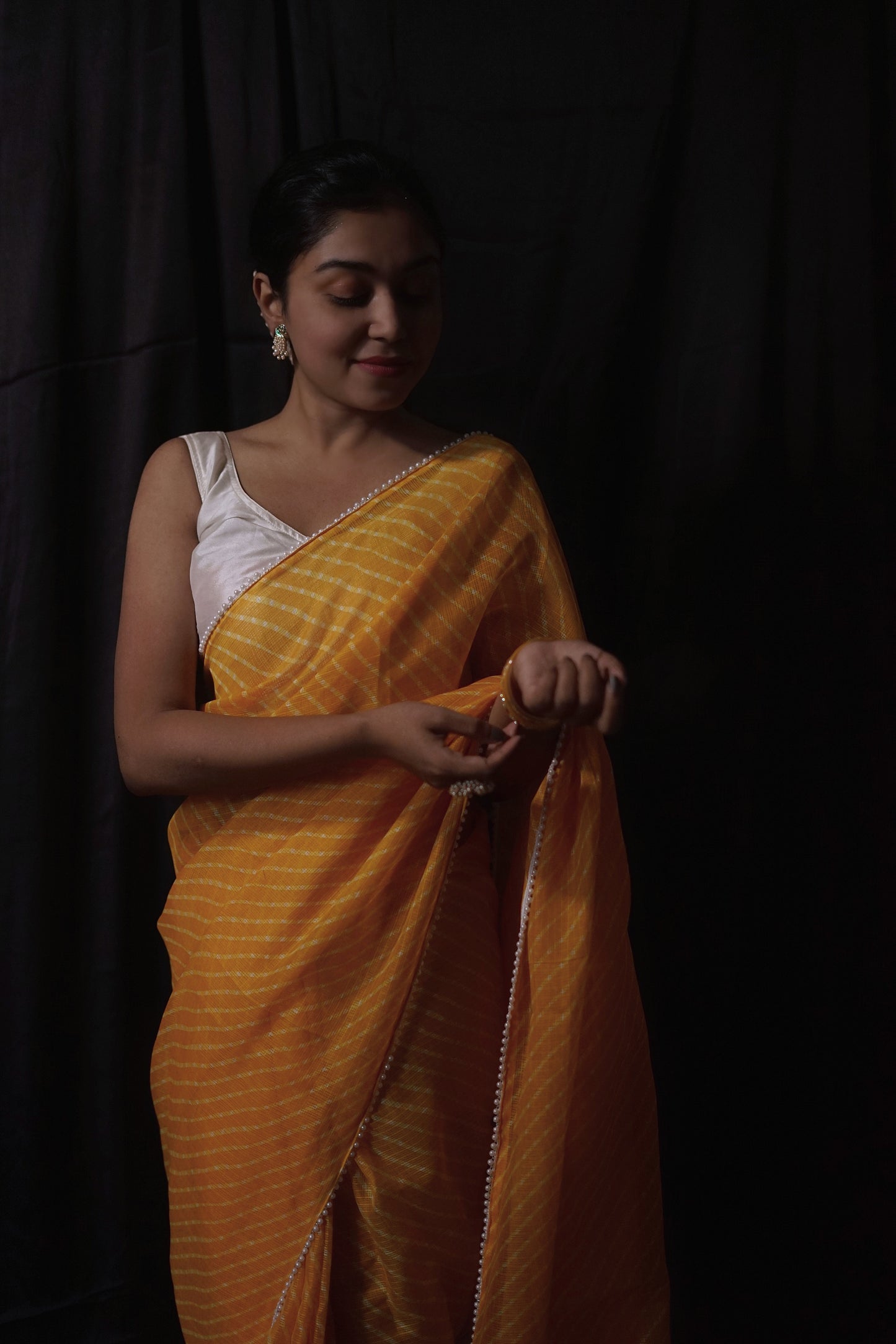Pearls in Yellow Leheriya Saree