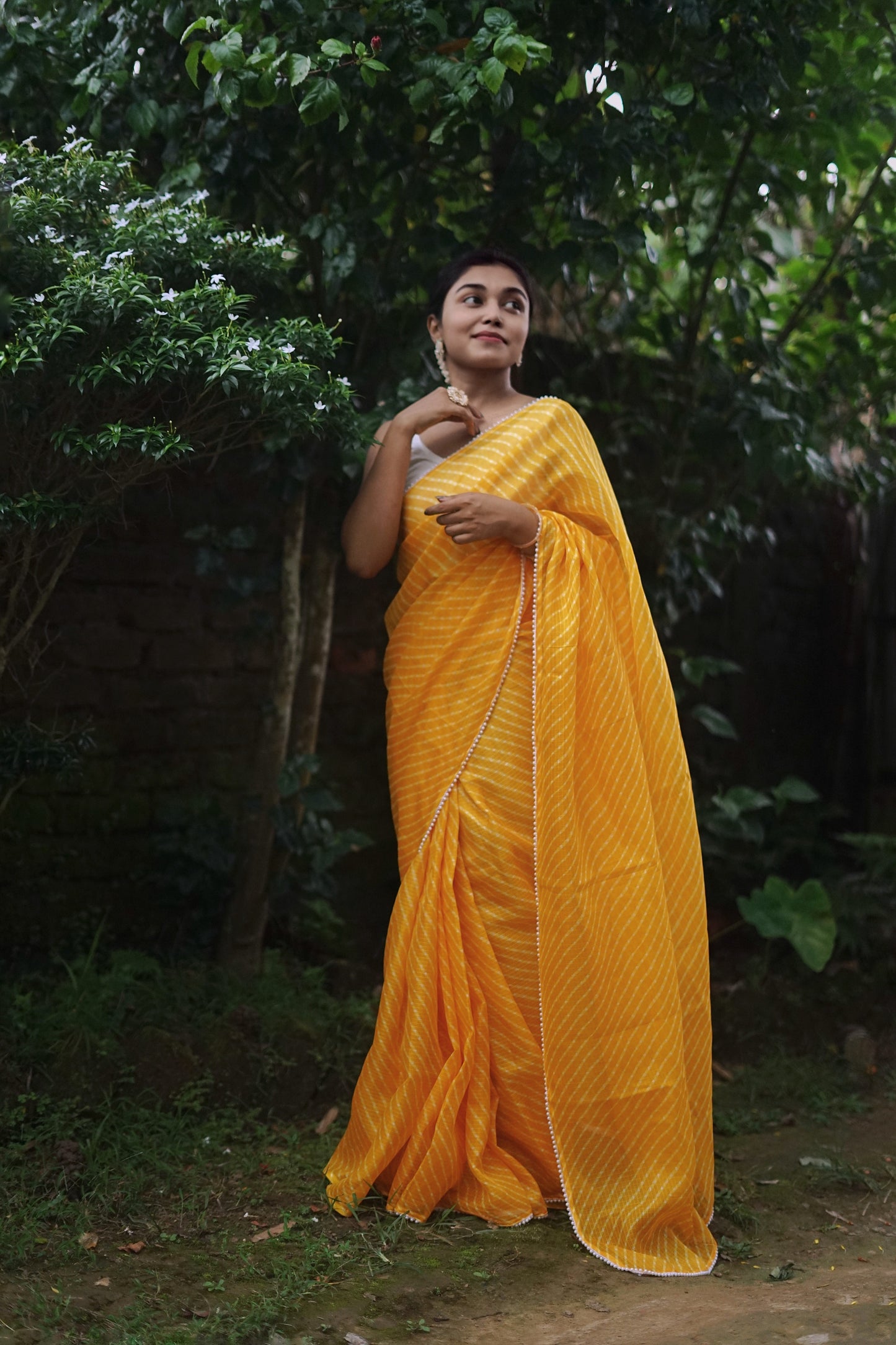 Pearls in Yellow Leheriya Saree