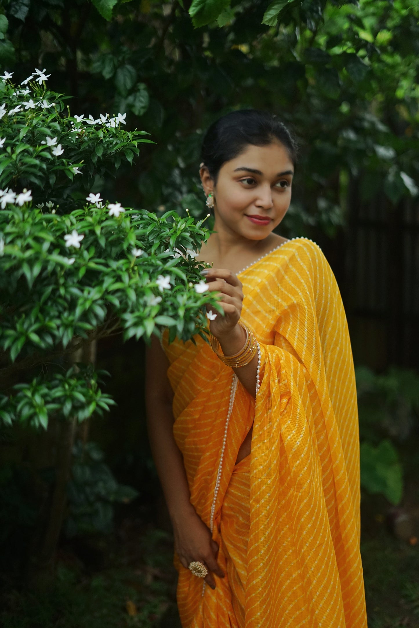 Pearls in Yellow Leheriya Saree