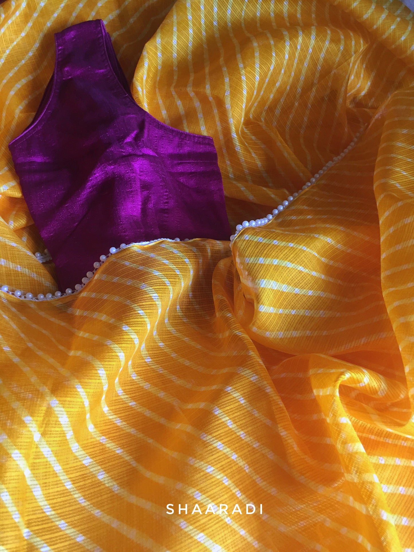 Pearls in Yellow Leheriya Saree