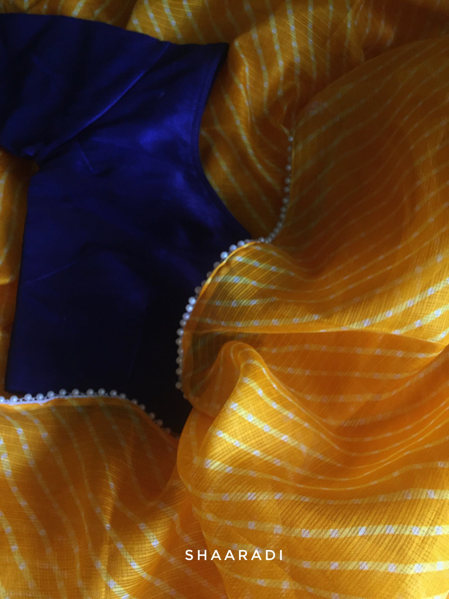 Pearls in Yellow Leheriya Saree