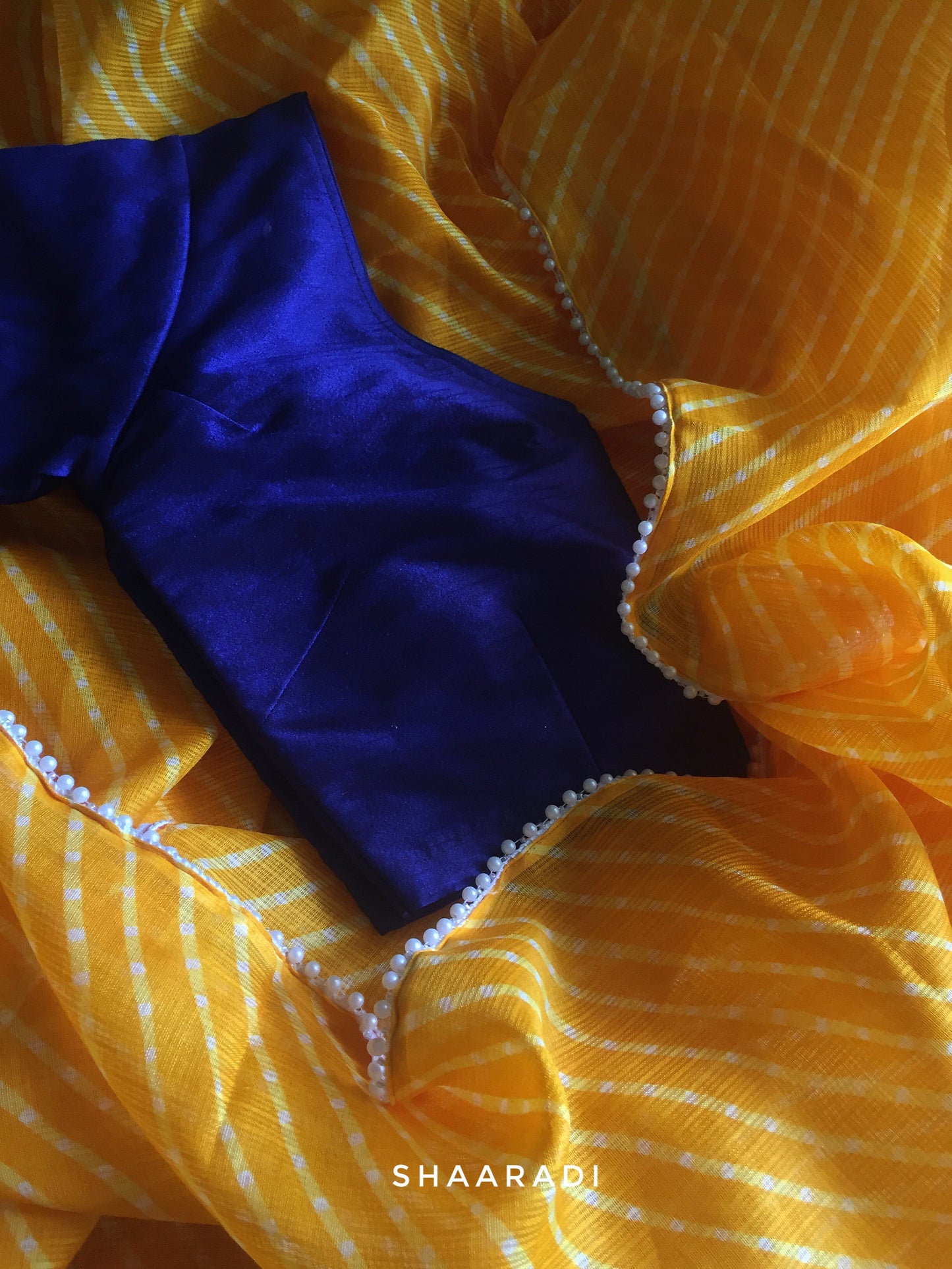 Pearls in Yellow Leheriya Saree
