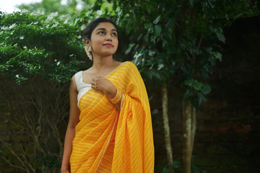 Pearls in Yellow Leheriya Saree
