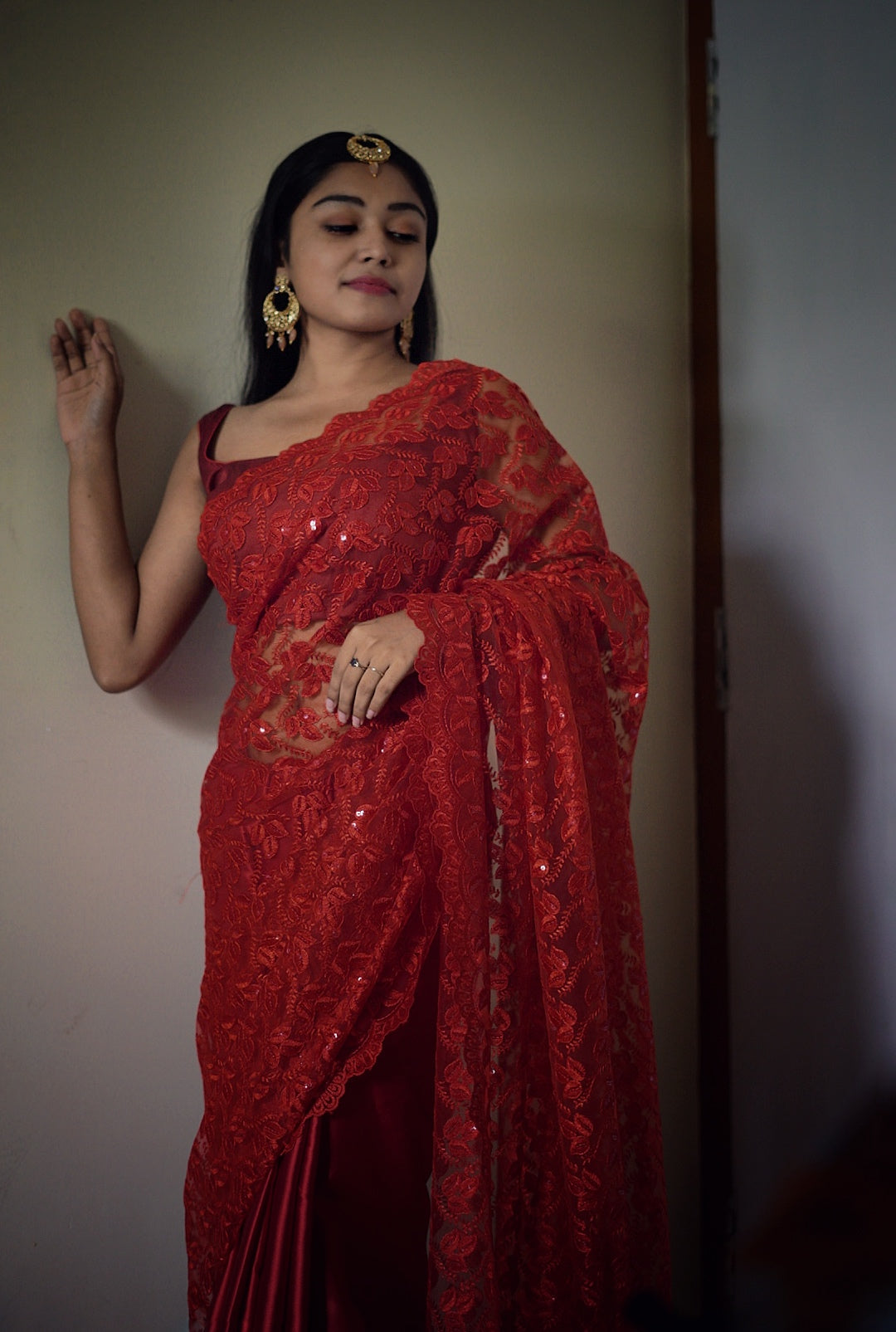 Sequinned red net-satin saree