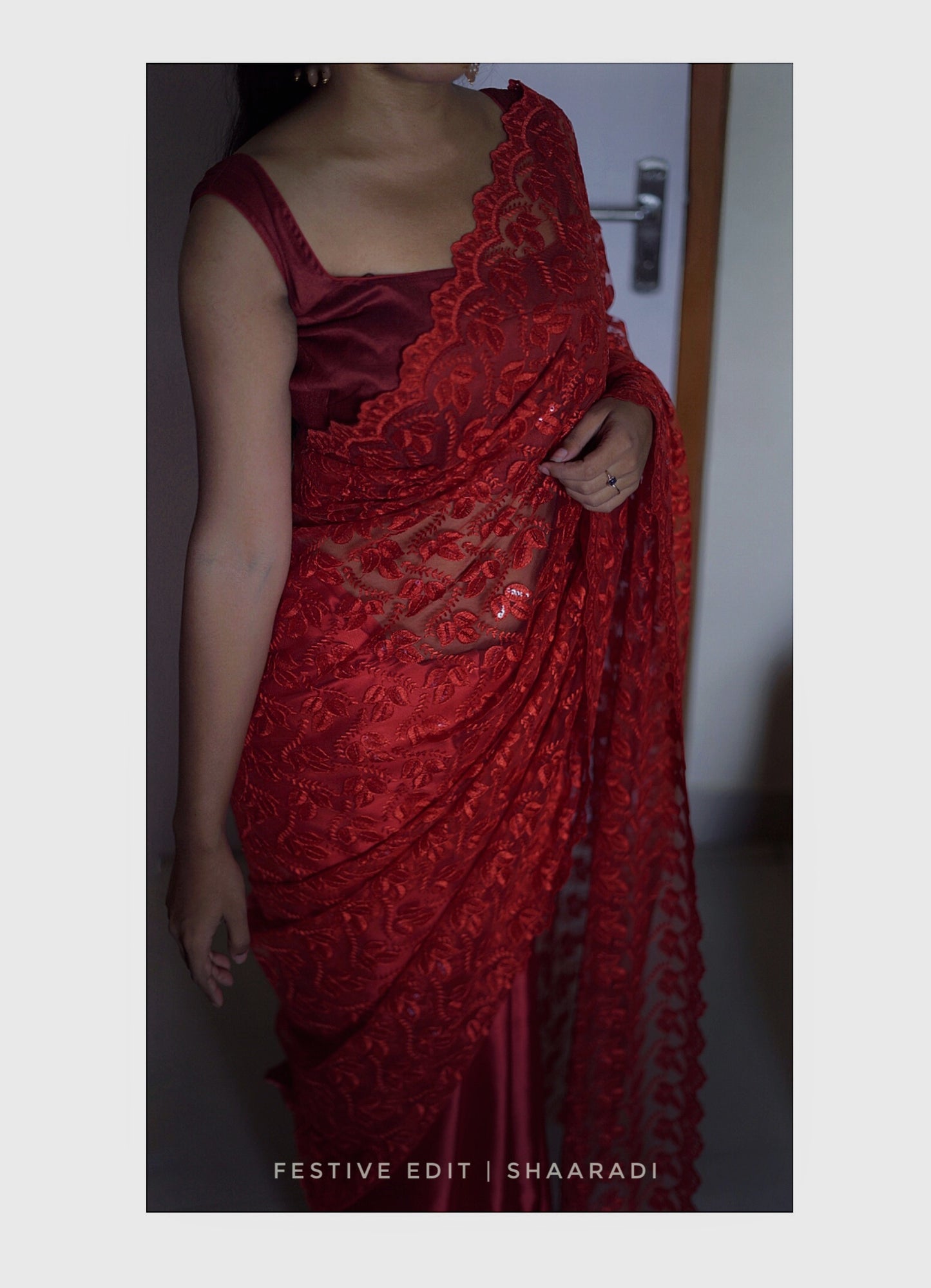 Sequinned red net-satin saree